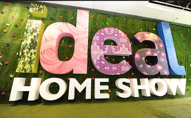 Ideal Home Show Green floral wal and colour 'Ideal' writing