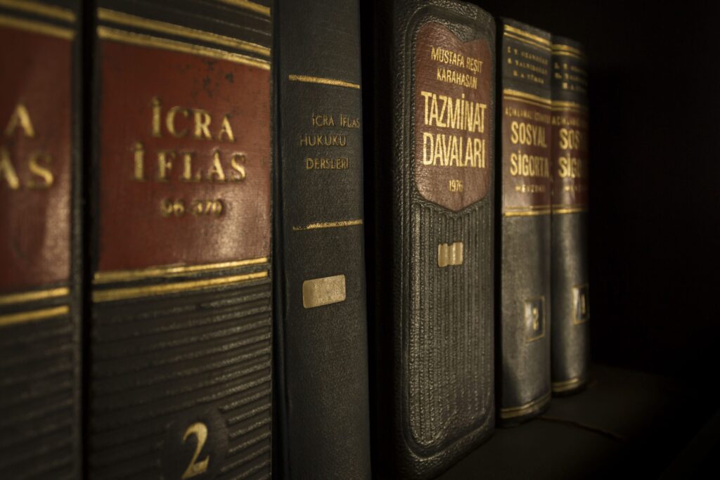 The GENIUS Act Becomes Law — America Gets Its First Stablecoin Framework Detailed close-up of law and regulation books on a bookshelf, emphasizing education and knowledge.