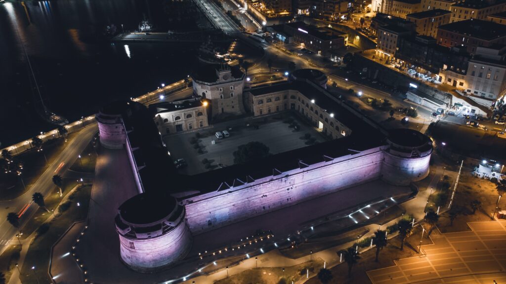 Trump Signs the Bitcoin Reserve Order — America Goes Digital Fort Knox Stunning aerial view of the illuminated Forte Michelangelo at night in Civitavecchia, Italy.