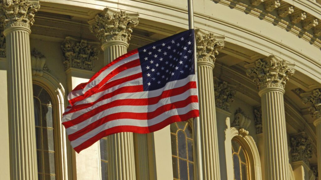 The Day Wall Street Took Off - What a Closed Market Is Worth US flag waving outside the iconic US Capitol Building in Washington, DC.