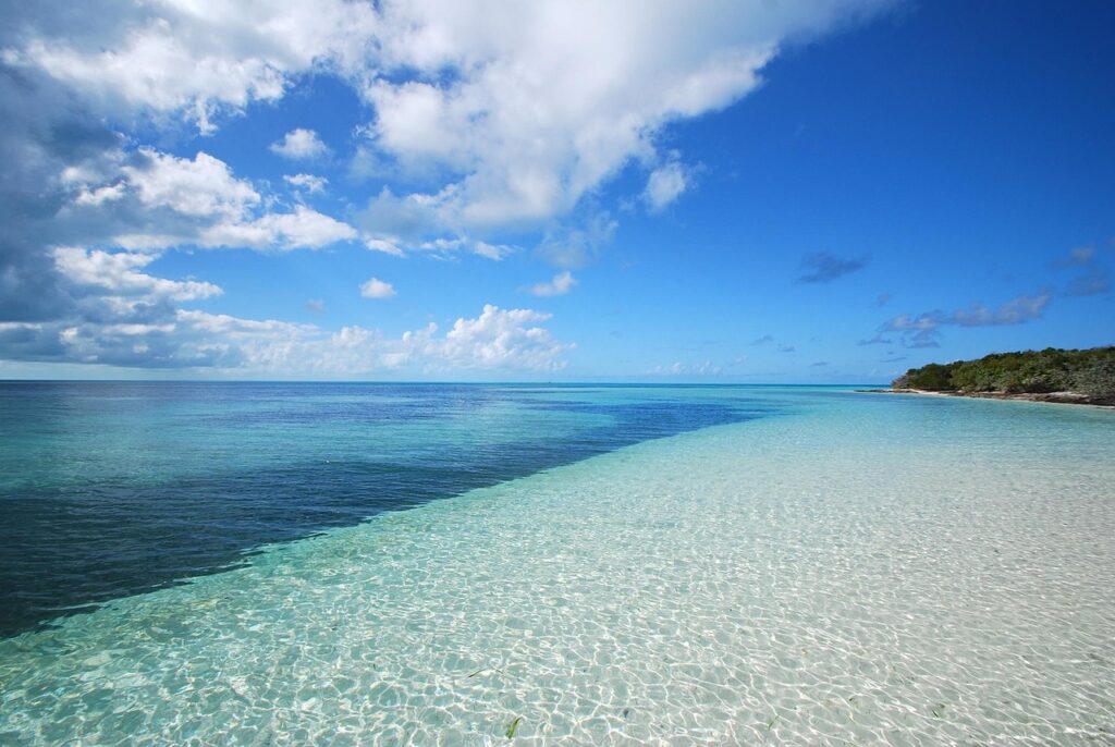 The New Luxury Is an Empty Beach blue water, empty beach, vacation, water, beach, sea, blue, summer, sand, sky, travel, ocean, tropical, empty, shore, landscape, holiday, blue sky, relax, seascape, paradise, horizon, idyllic, nature, relaxation, turquoise, blue beach, blue relax, blue sand