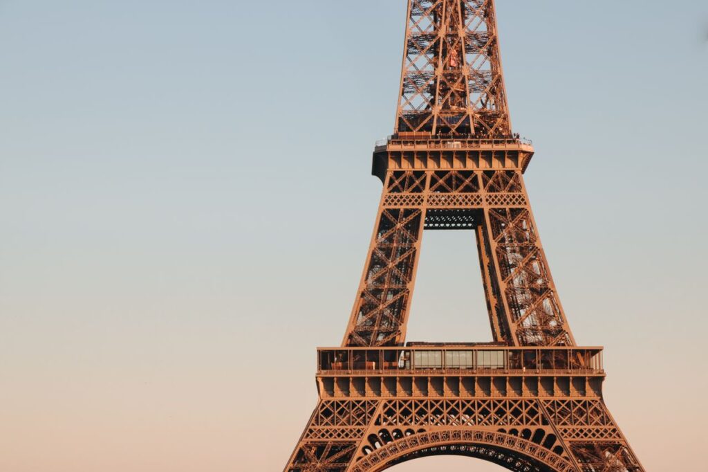 Markets Don’t Vote, But They Definitely Have Opinions Captivating sunset view of the Eiffel Tower's intricate architecture in Paris, France.