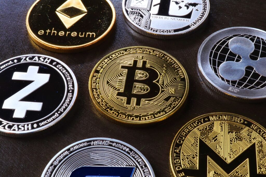 The Altcoin ETF Flood: XRP, Solana, Dogecoin Get Their Moment Detailed view of assorted cryptocurrency coins including Bitcoin, Ethereum, and Ripple.