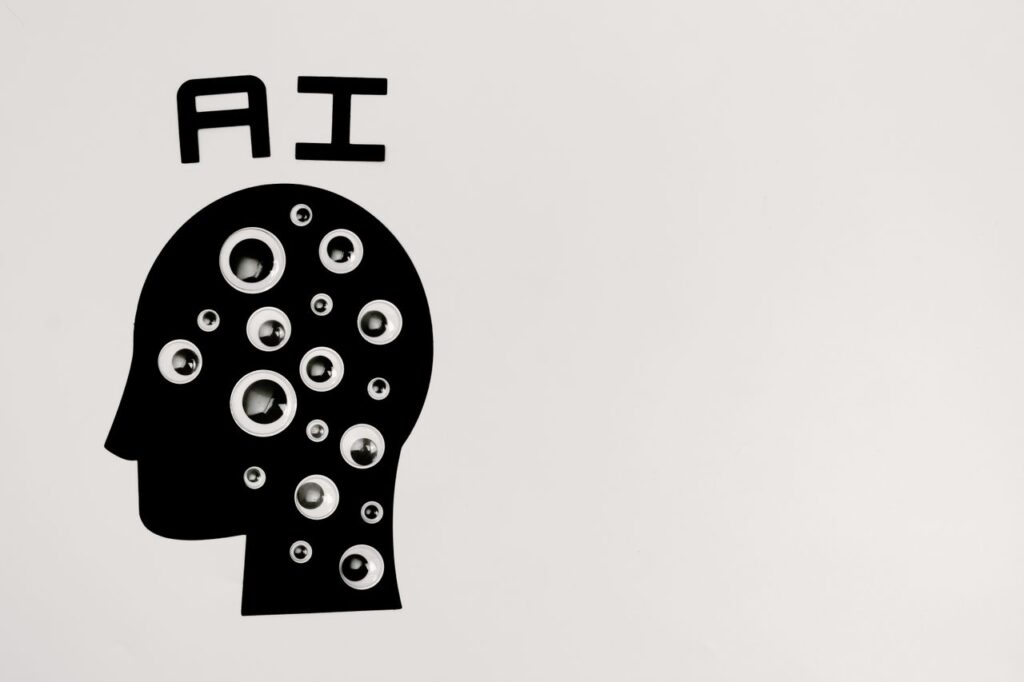 The AI Boom Is Being Built on Borrowed Money Abstract illustration of AI with silhouette head full of eyes, symbolizing observation and technology.