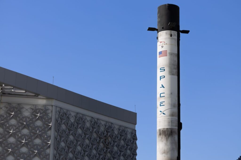 When the Insiders Are Allowed to Sell A SpaceX Falcon 9 rocket displayed outdoors against a clear blue sky in Dubai.