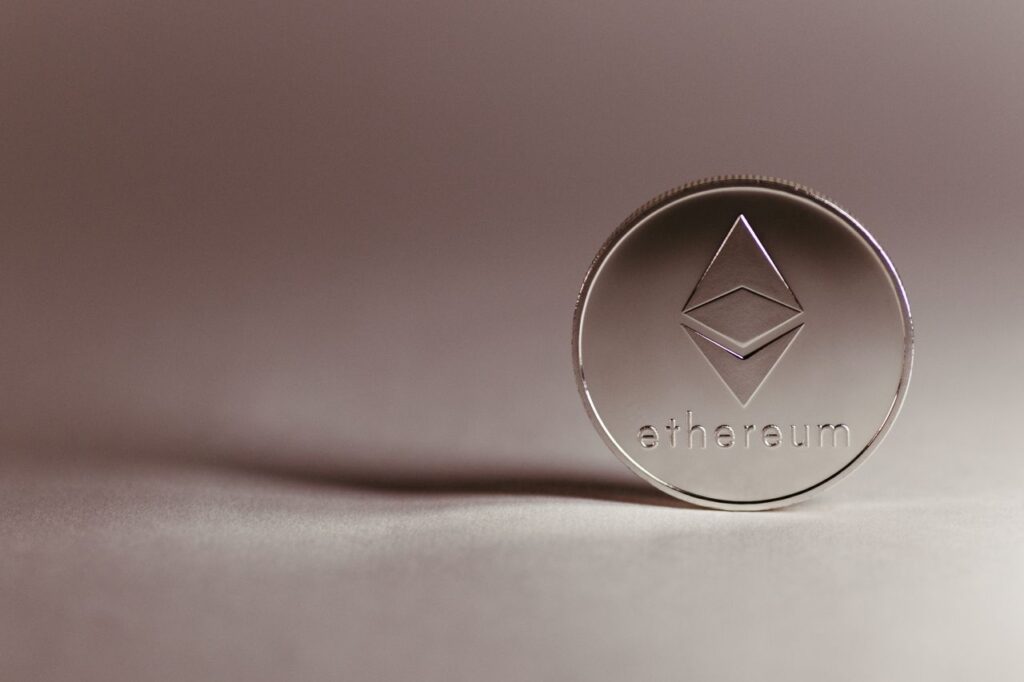 Ethereum Is Not Bitcoin. Good. Close-up of a silver Ethereum coin symbolizing digital currency and blockchain technology.