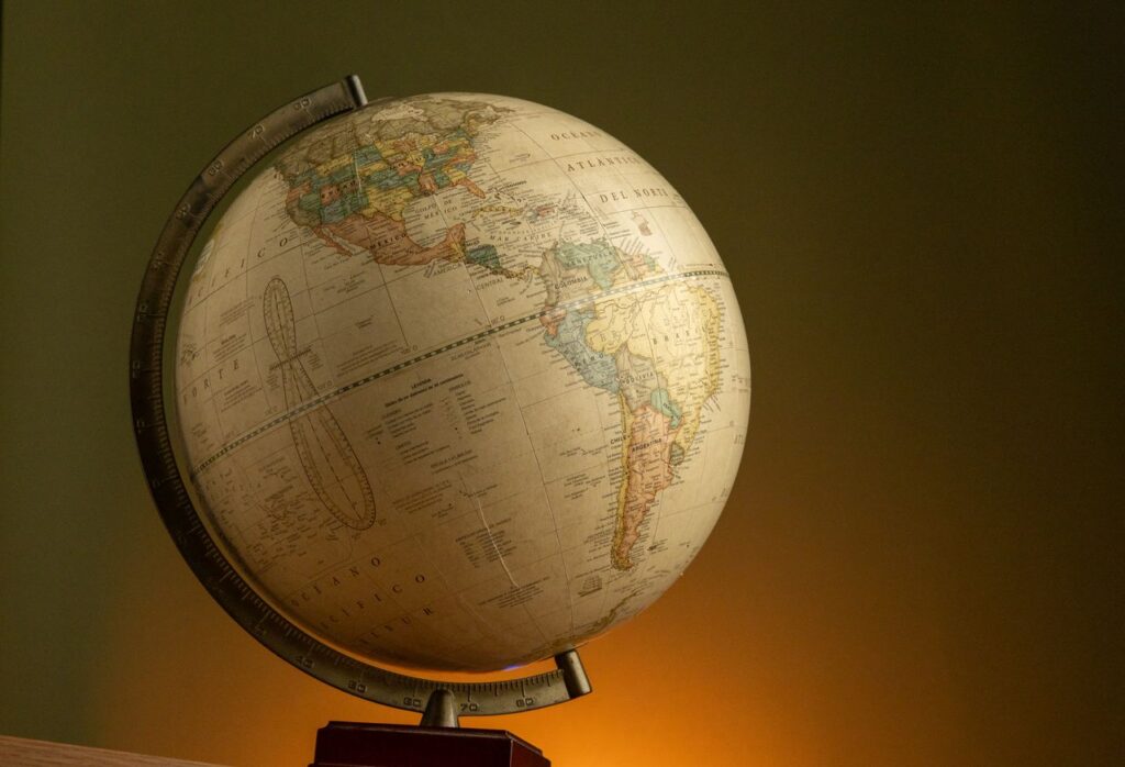 Elegant vintage globe showcasing world geography with a warm ambient background.