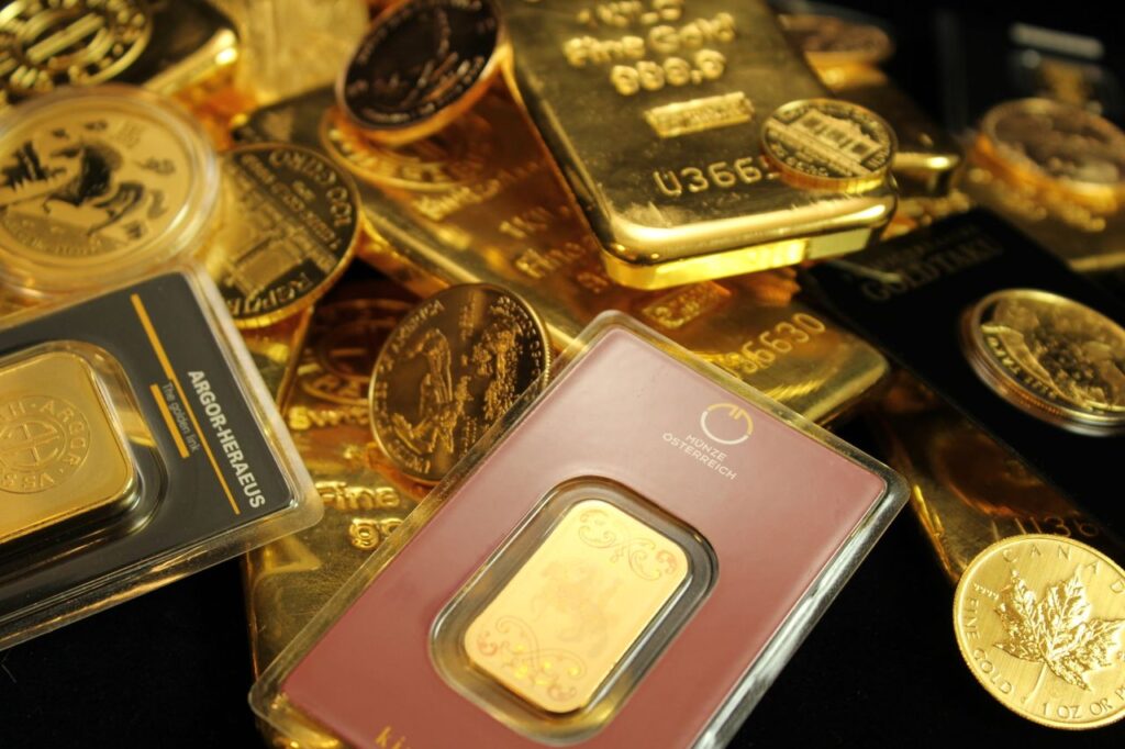 Gold's Quiet Comeback Detailed close-up of gold bars and coins symbolizing wealth and investment opportunities.