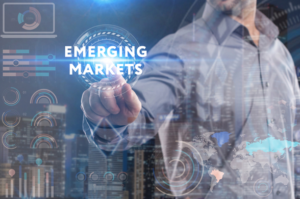 Articles Emerging Markets transparent screen with man pointing to it