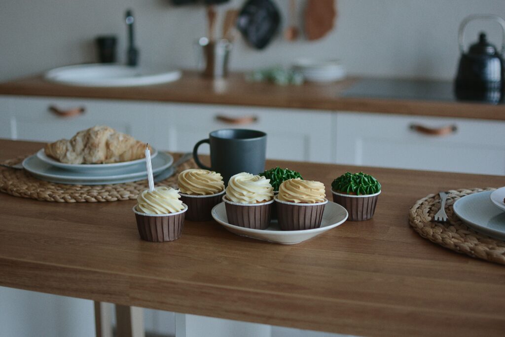 Can Home Baking Pay Its Way? Cupcakes and pastries on a kitchen counter, perfect for dessert lovers.