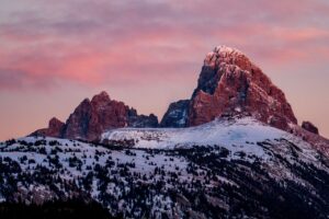 Articles Scenic view of Grand Teton mountain at sunrise with a winter snow cover.